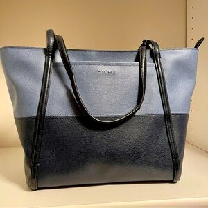 Tumi Quintessential “Q” Tote in coated canvas